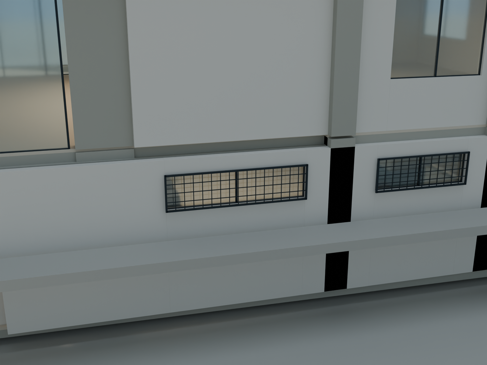 Long rectangular west windows with outside square grilles